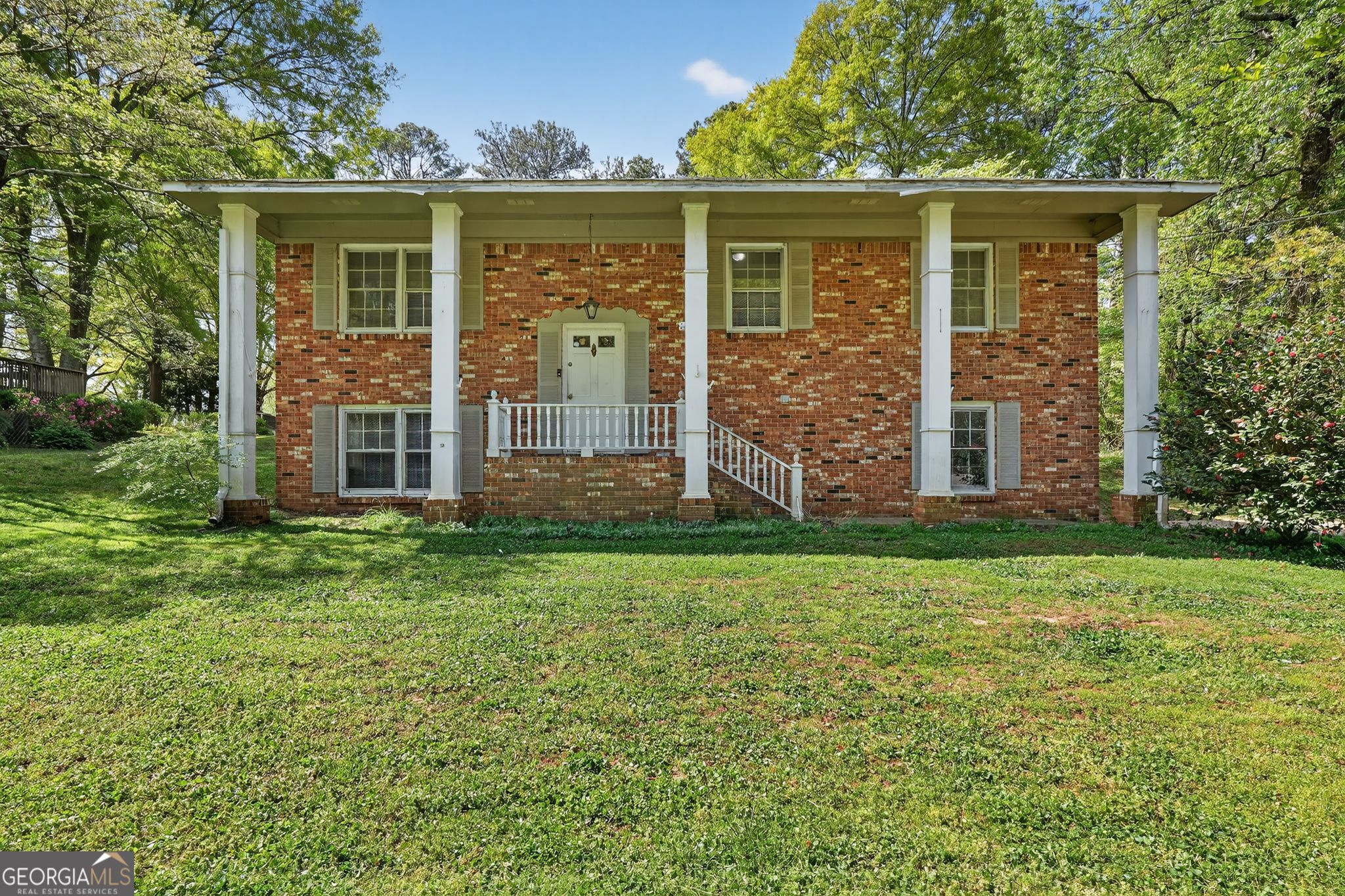 1071 Luther Drive Southwest Mableton, GA 30126 - Photo 1 of 27 front view of a house with a yard