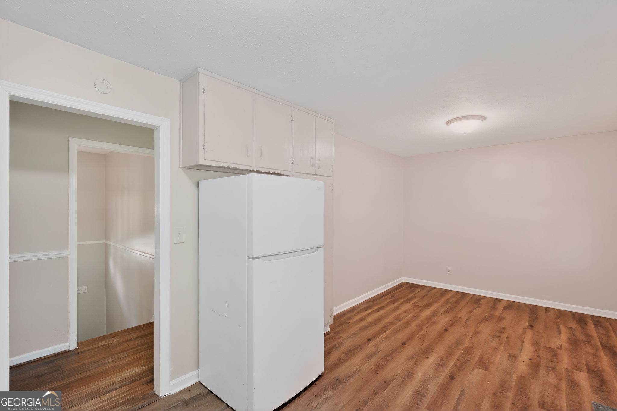 1071 Luther Drive Southwest Mableton, GA 30126 - Photo 13 of 27 a view of empty room with wooden floor