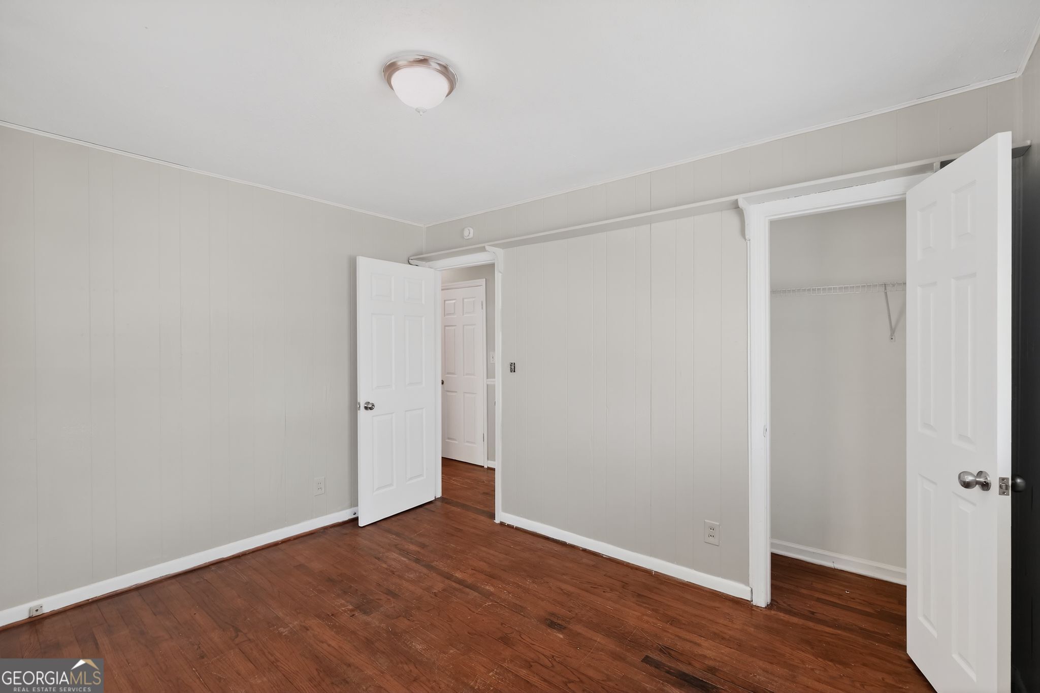 1071 Luther Drive Southwest Mableton, GA 30126 - Photo 16 of 27 a view of an empty room with wooden floor
