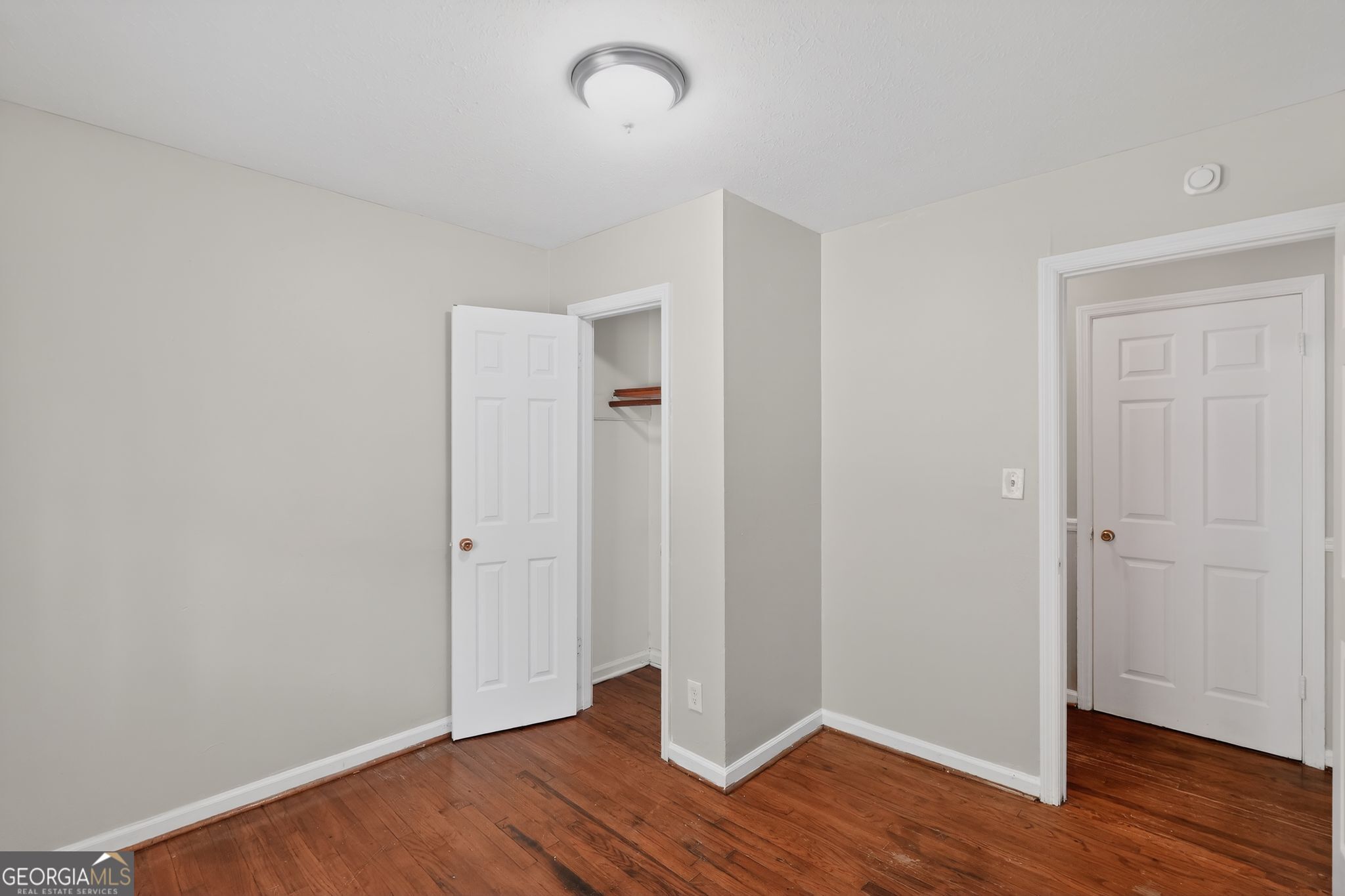 1071 Luther Drive Southwest Mableton, GA 30126 - Photo 18 of 27 an empty room with wooden floor
