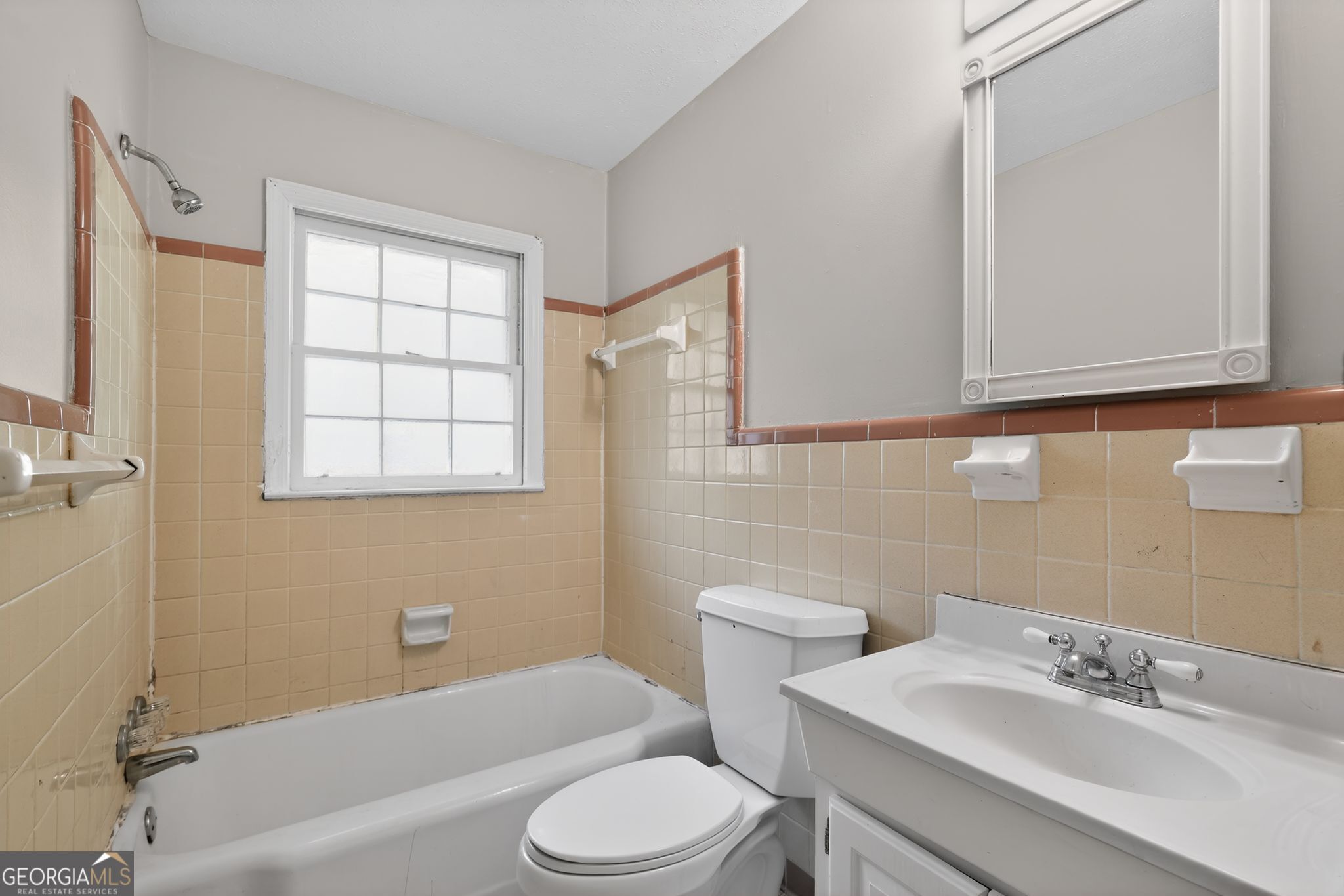 1071 Luther Drive Southwest Mableton, GA 30126 - Photo 22 of 27 a bathroom with a sink toilet and shower