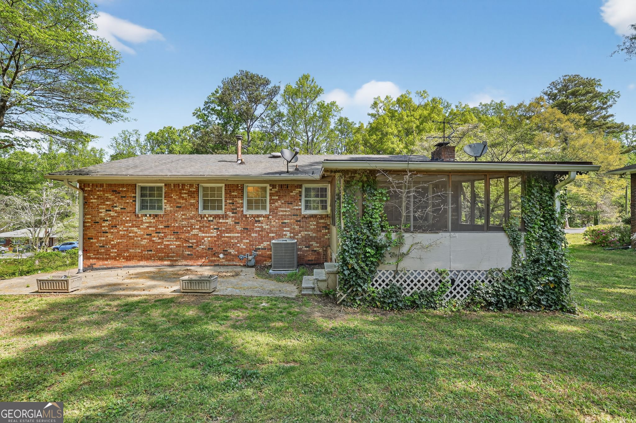 1071 Luther Drive Southwest Mableton, GA 30126 - Photo 27 of 27 a view of a house with backyard and a garden
