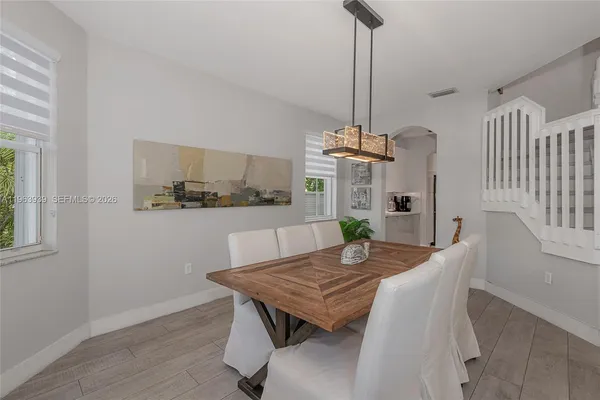 a kitchen that has a sink and a stove in it