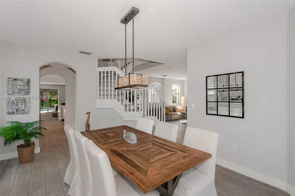 a view of kitchen with furniture and wooden floor