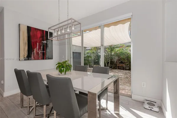 a view of living room with granite countertop furniture and a flat screen tv