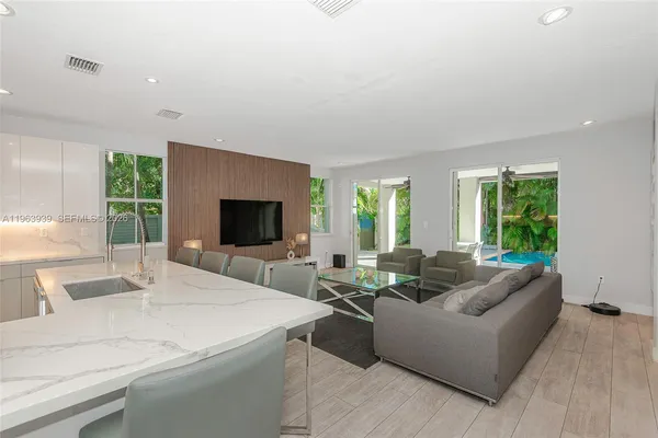 a view of a dining room with furniture window and wooden floor