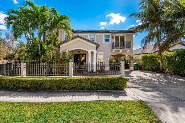 a view of a house with a yard and garage
