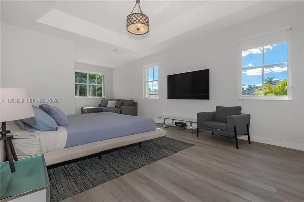 a workspace with wooden floor and a window