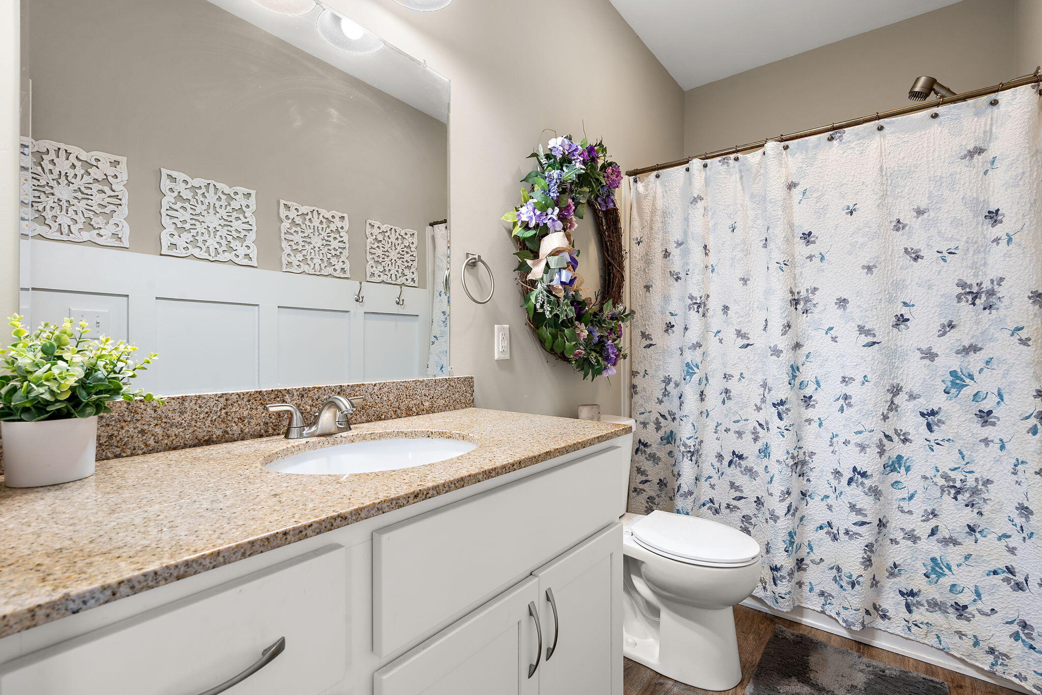 1171 Weaver Way Chesterton, IN 46304 - Photo 15 of 25 a bathroom with a granite countertop sink a toilet and a mirror