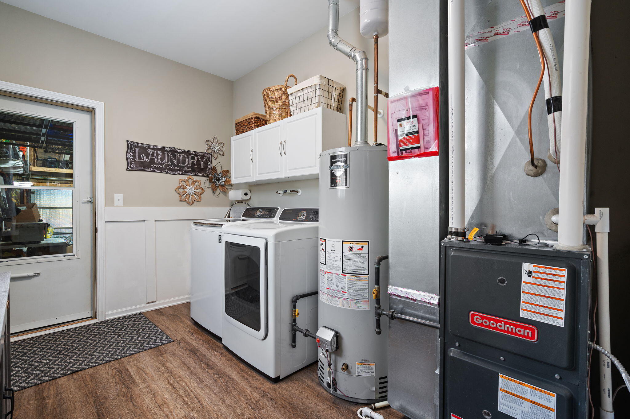 1171 Weaver Way Chesterton, IN 46304 - Photo 19 of 25 a utility room with cabinets dryer and washer