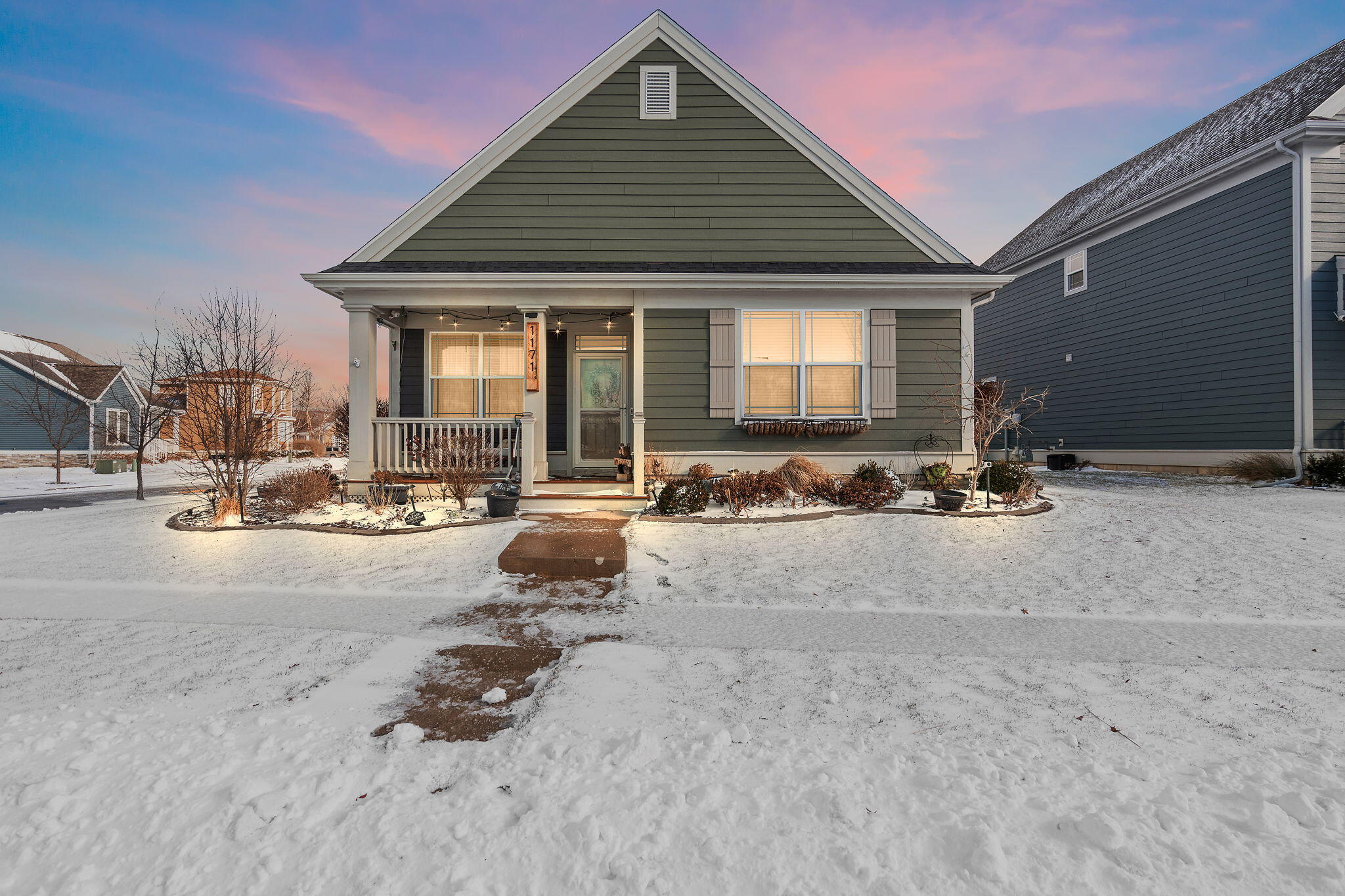 1171 Weaver Way Chesterton, IN 46304 - Photo 2 of 25 a view of a swimming pool with chairs in front of house
