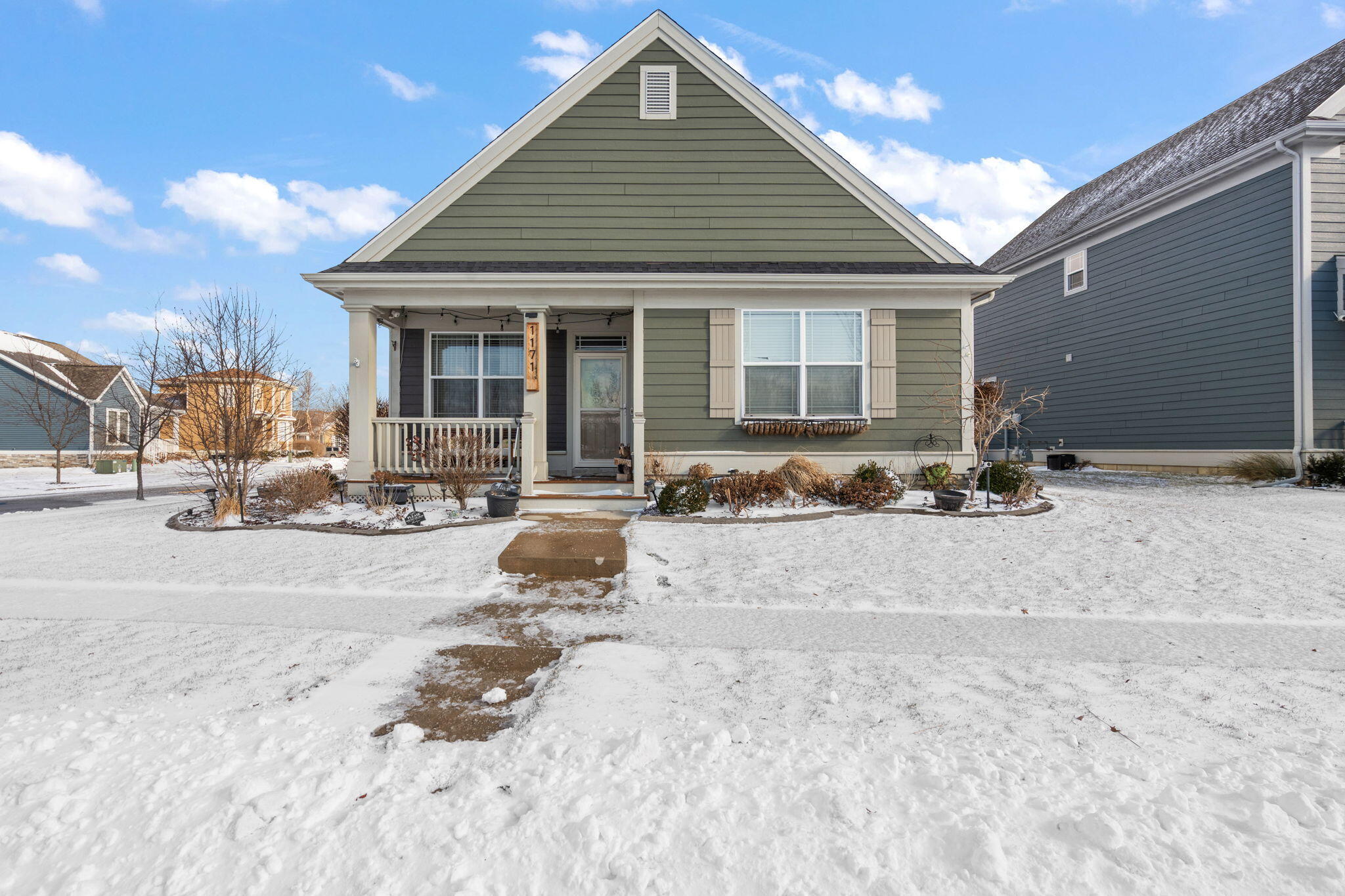 1171 Weaver Way Chesterton, IN 46304 - Photo 3 of 25 a view of a house with a yard covered in snow
