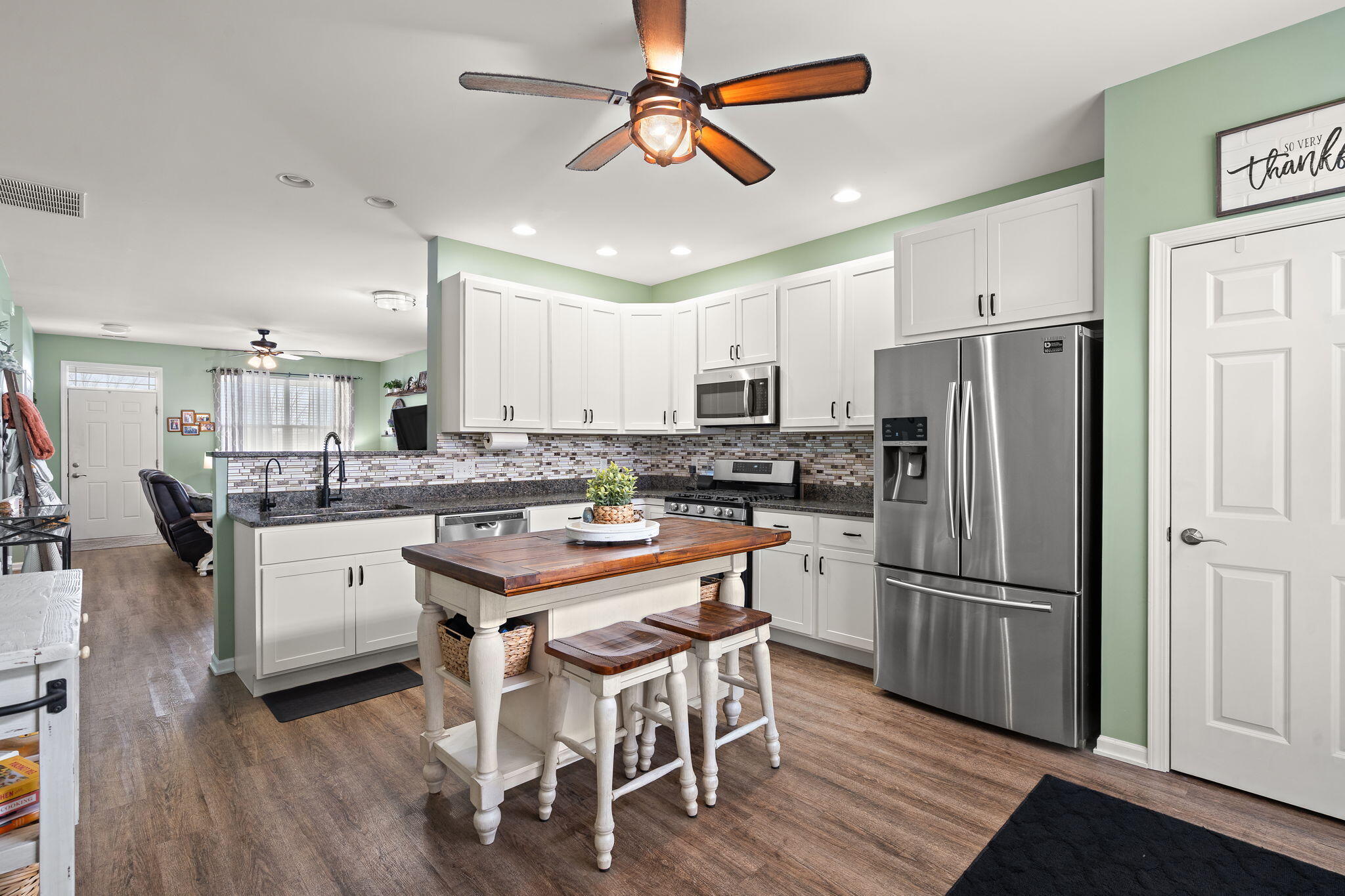 1171 Weaver Way Chesterton, IN 46304 - Photo 10 of 25 a kitchen with white cabinets and stainless steel appliances