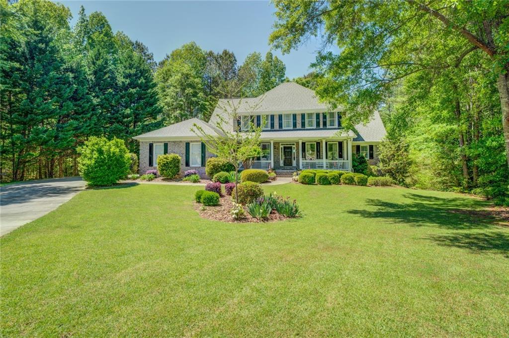 5219 Fieldspring Lane Covington, GA 30014 - Photo 1 of 1 a view of a house with a yard table and chairs