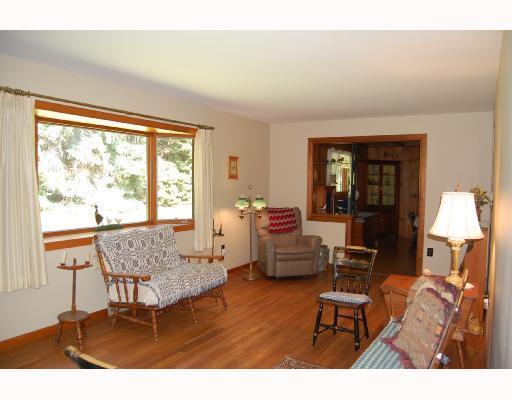 341 Rolshouse Road Pittsburgh, PA 15237 - Photo 2 of 8 Living Room. 23 FOOT LIVING ROOM GRACED WITH HARDWOOD FLOORS & BAY WINDOW WITH A VIEW OF THE SURROUNDING PROPERTY.