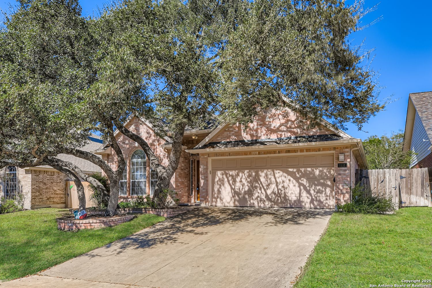1111 Crystal Spring San Antonio, TX 78258 - Photo 1 of 1 a view of a yard with a tree in the background
