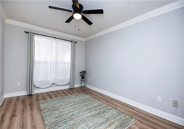 a room with pool table flat screen tv and windows