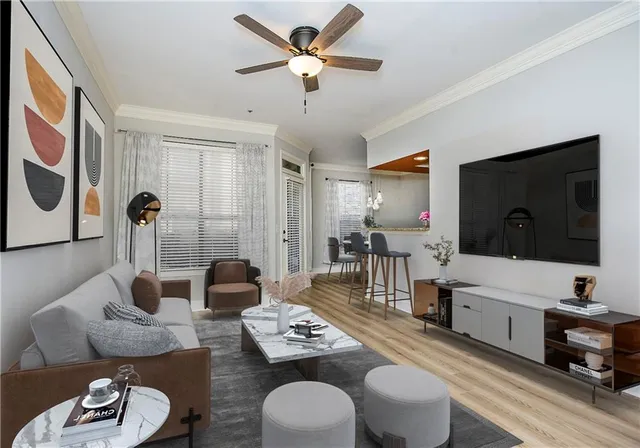 a living room with furniture and a flat screen tv