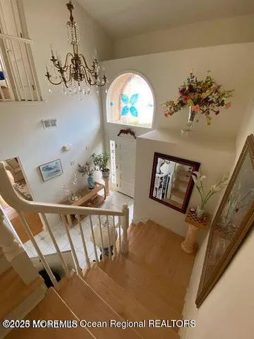 a view of workspace with wooden floor and window