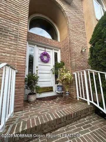 a view of a livingroom with furniture and chandelier