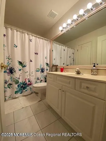 a view of balcony with wooden floor and outdoor seating