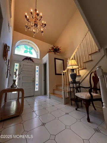 a bathroom with a toilet and a picture of the wall