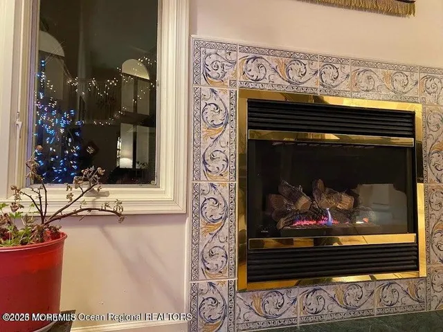 a kitchen with stainless steel appliances granite countertop a stove a sink a microwave and dining table