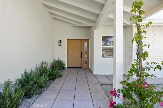 a view of entryway with flower pots