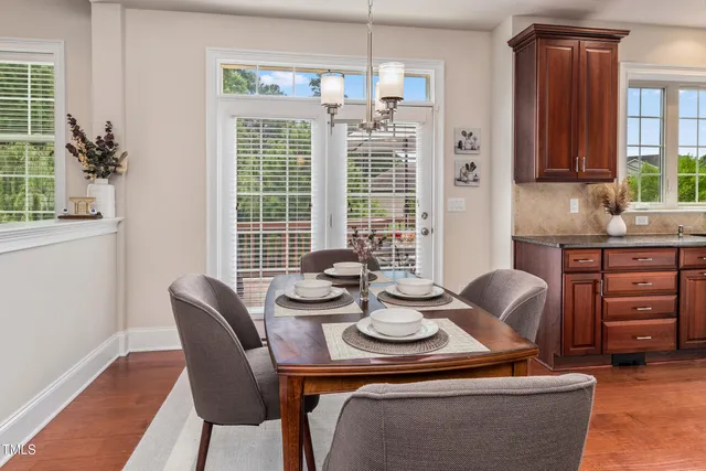 a view of a dining room with furniture window and outside view