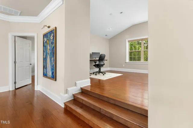 a view of an entryway with wooden floor