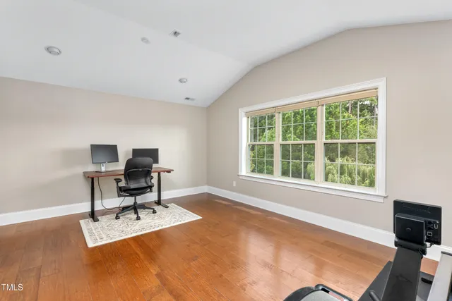 a workspace with furniture and a window