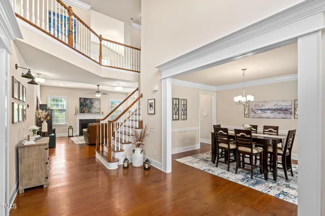 a view of a dining room with furniture wooden floor and a rug