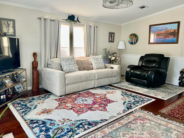 a living room with furniture and a rug
