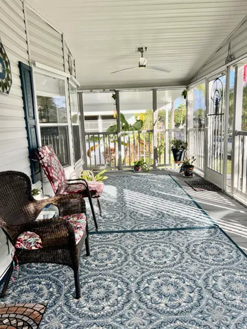 a view of a porch with furniture
