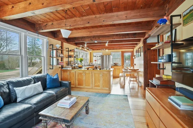 a living room with furniture and a table