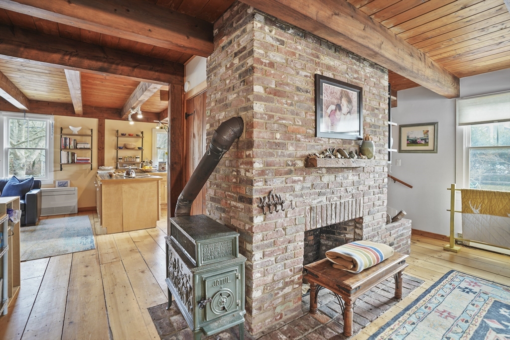 44 Planting Field Way Edgartown, MA 02539 - Photo 16 of 33 a living room with furniture and a fireplace