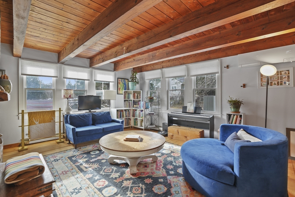 44 Planting Field Way Edgartown, MA 02539 - Photo 17 of 32 a living room with furniture and a floor to ceiling window