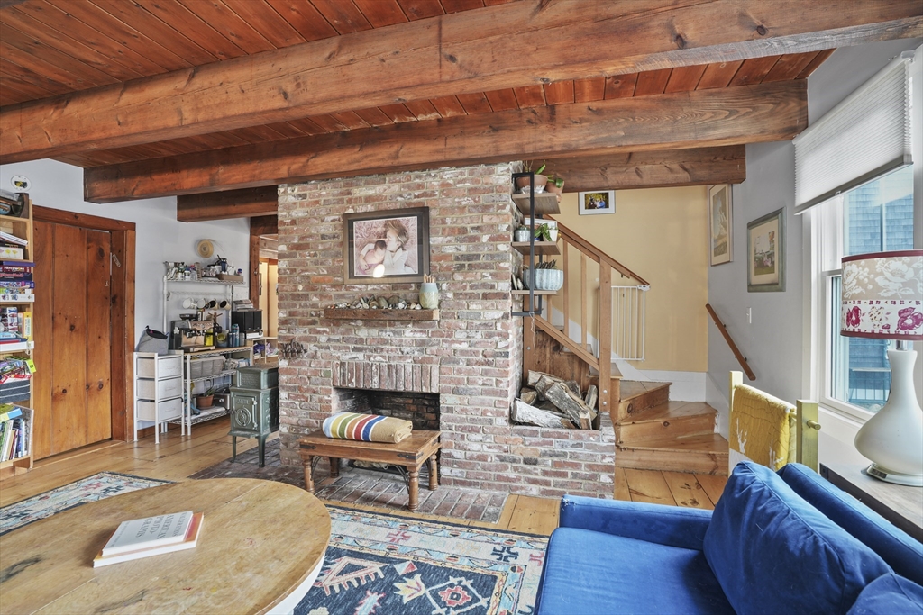 44 Planting Field Way Edgartown, MA 02539 - Photo 19 of 33 a living room with furniture and a fireplace