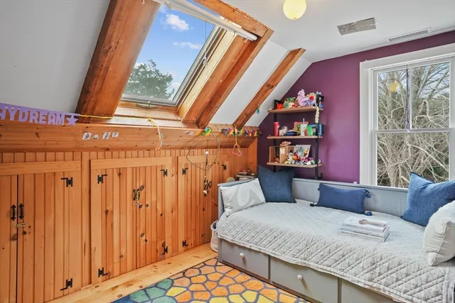 a view of a bedroom with washer and dryer