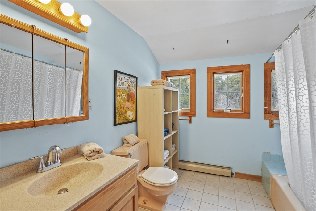 44 Planting Field Way Edgartown, MA 02539 - Photo 23 of 32 a bathroom with a sink toilet and shower
