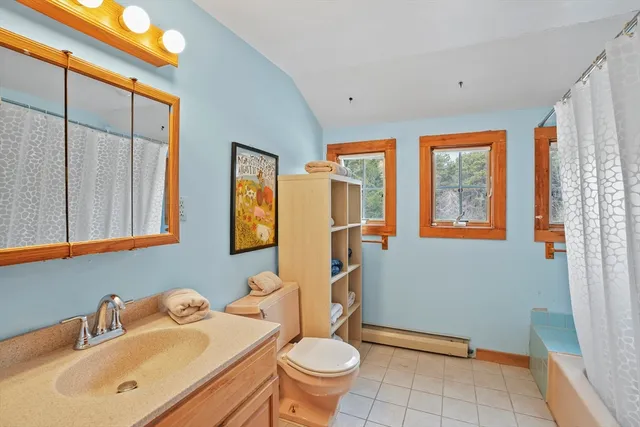 a kitchen with sink cabinets and wooden floor