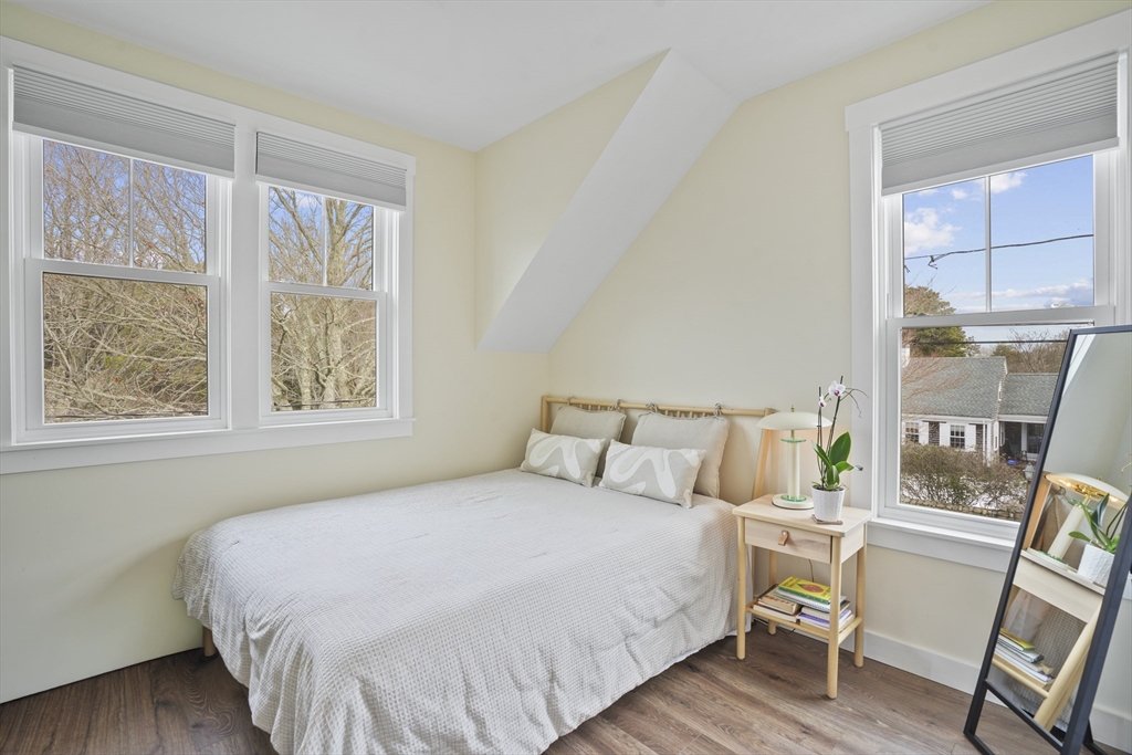 44 Planting Field Way Edgartown, MA 02539 - Photo 30 of 33 a bedroom with a large bed and a window