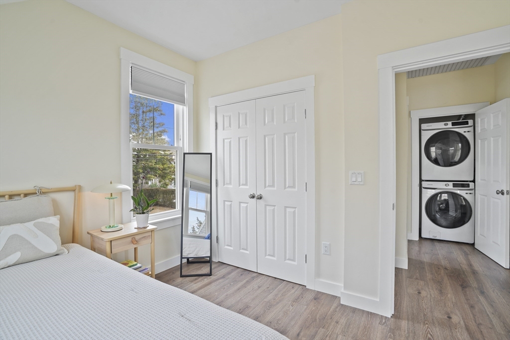 44 Planting Field Way Edgartown, MA 02539 - Photo 30 of 32 a view of a bedroom with washer and dryer