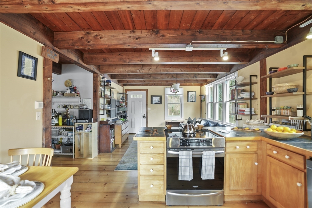 44 Planting Field Way Edgartown, MA 02539 - Photo 10 of 32 a kitchen with a stove and cabinets