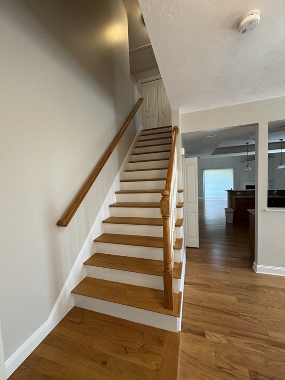 53 Baldwin Road, Unit 1401 Billerica, MA 01821 - Photo 19 of 32 a view of entryway and hall with wooden floor