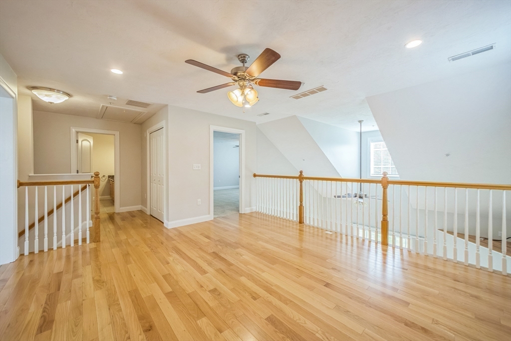 53 Baldwin Road, Unit 1401 Billerica, MA 01821 - Photo 20 of 32 a view of a hallway with wooden floor