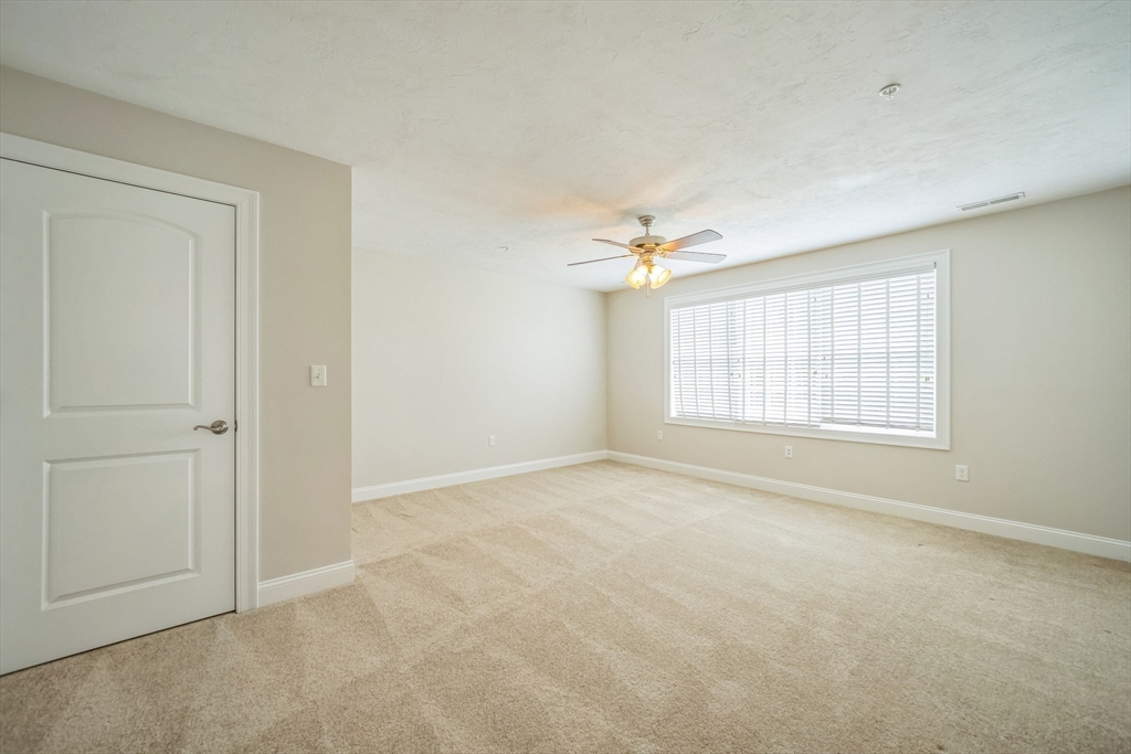 53 Baldwin Road, Unit 1401 Billerica, MA 01821 - Photo 23 of 32 a view of an empty room with a window