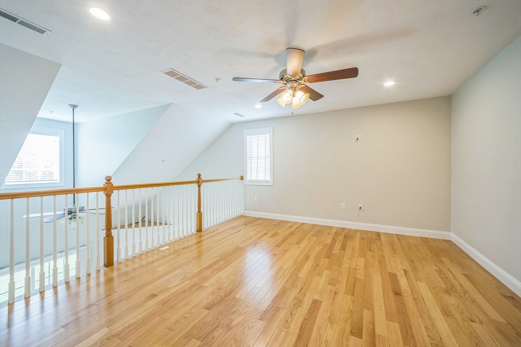 53 Baldwin Road, Unit 1401 Billerica, MA 01821 - Photo 28 of 32 a view of empty room with wooden floor and fan