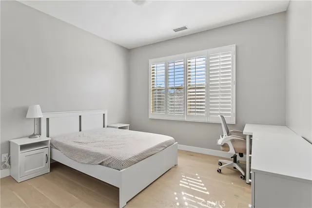 a bedroom with a bed and a table in it