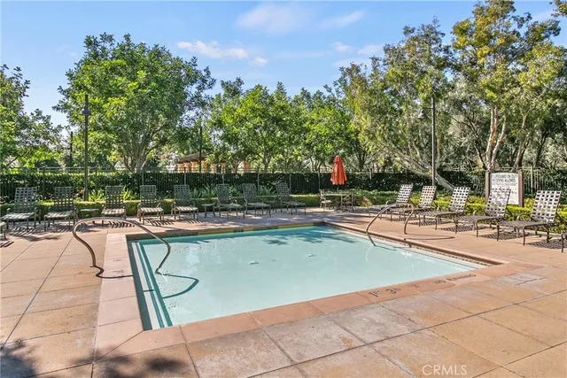a view of a swimming pool with chairs